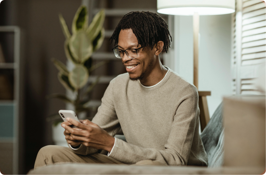 Black man browsing on phone